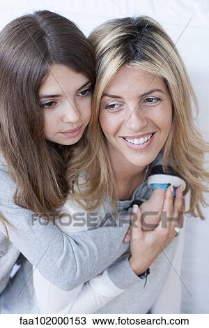 "Girl embracing her mother, portrait" View Large Photo Image Stock Image - "Girl embracing her mother, portrait". Fotosearch