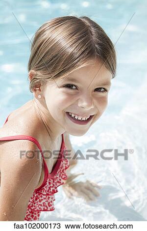 "Girl in swimming pool, smiling cheerfully, portrait" View Large Photo Image Stock Image - "Girl in swimming pool, smiling cheerfully, portrait". Fotosearch