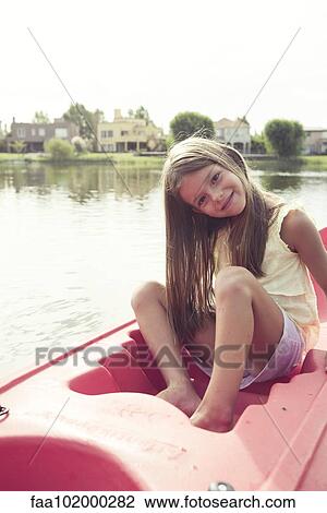 Girl kayaking on lake View Large Photo Image Stock Image - Girl kayaking on lake. Fotosearch