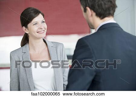 Hotel reception staff serving guest View Large Photo Image Stock Photography - Hotel reception staff serving guest. Fotosearch