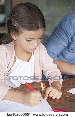 Stock Image - Little girl drawing with markers. Fotosearch