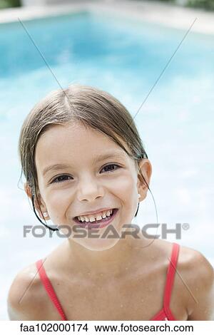 "Little girl in swimming pool, smiling cheerfully, portrait" View Large Photo Image Picture - "Little girl in swimming pool, smiling cheerfully, portrait". Fotosearch