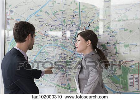 Man and woman planning route on Paris metro View Large Photo Image Stock Image - Man and woman planning route on Paris metro. Fotosearch