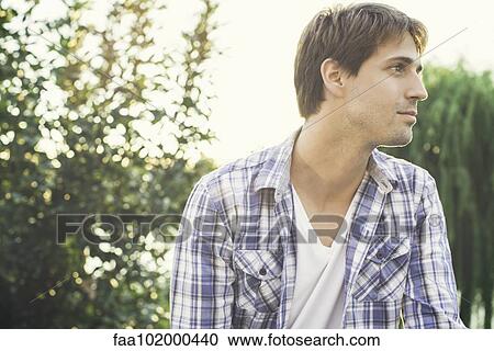 Stock Image - Man enjoying view outdoors. Fotosearch