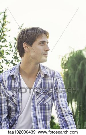 Stock Photo - Man outdoors enjoying view. Fotosearch