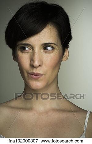"Mid-adult woman glancing sideways, portrait" View Large Photo Image Stock Photo - "Mid-adult woman glancing sideways, portrait". Fotosearch