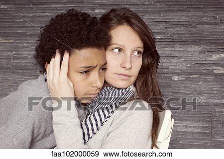 "Mother consoling upset young son, portrait" View Large Photo Image Stock Photo - "Mother consoling upset young son, portrait". Fotosearch