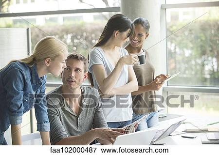 Stock Photo - Office workers bonding. Fotosearch