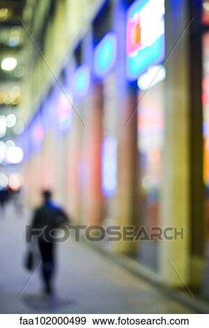 "Pedestrian walking on sidewalk at night, defocused" View Large Photo Image Stock Photo - "Pedestrian walking on sidewalk at night, defocused". Fotosearch