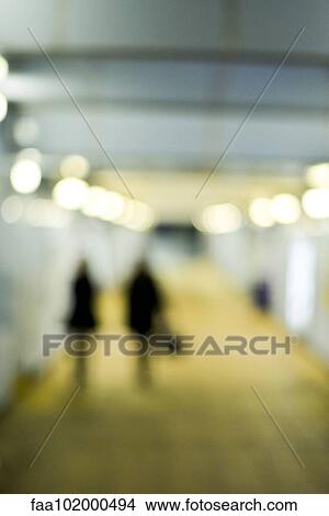 "Pedestrians walking at night, defocused" View Large Photo Image Picture - "Pedestrians walking at night, defocused". Fotosearch