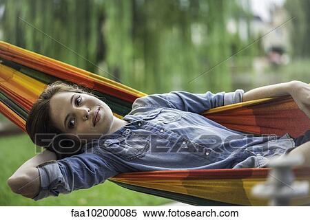 Woman relaxing in hammock View Large Photo Image Stock Photography - Woman relaxing in hammock. Fotosearch