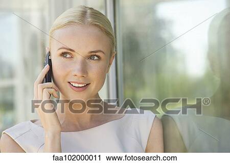 Woman talking on cell phone View Large Photo Image Stock Image - Woman talking on cell phone. Fotosearch