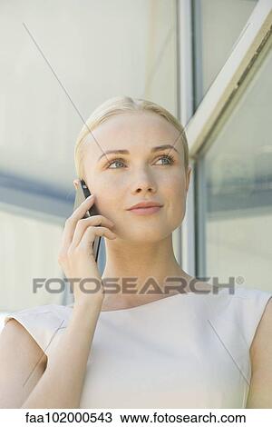 "Woman using cell phone, portrait" View Large Photo Image Stock Image - "Woman using cell phone, portrait". Fotosearch