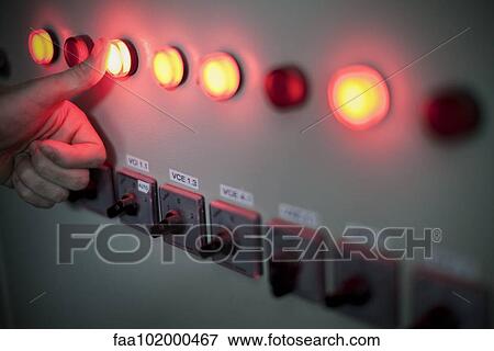 Worker pressing illuminated buttons on industrial control panel View Large Photo Image Stock Photo - Worker pressing illuminated buttons on industrial control panel. Fotosearch