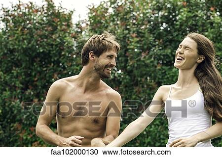 Young couple enjoying summer vacation together View Large Photo Image Stock Image - Young couple enjoying summer vacation together. Fotosearch