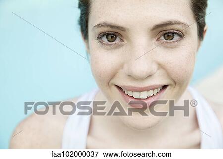 "Young woman smiling cheerfully, portrait" View Large Photo Image Stock Photo - "Young woman smiling cheerfully, portrait". Fotosearch