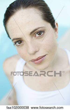 "Young woman smiling with head tilted, portrait" View Large Photo Image Stock Photo - "Young woman smiling with head tilted, portrait". Fotosearch
