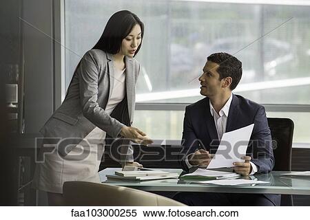 Assistant working with executive View Large Photo Image Stock Photography - Assistant working with executive. Fotosearch