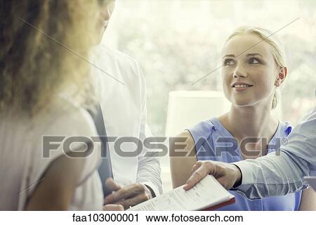 Associate handing colleague document View Large Photo Image Stock Image - Associate handing colleague document. Fotosearch