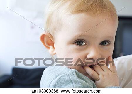 "Baby chewing on fingers, portrait" View Large Photo Image Stock Photo - "Baby chewing on fingers, portrait". Fotosearch