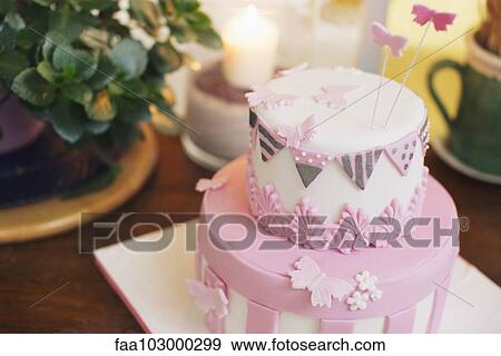 Birthday cake decorated with fondant butterflies View Large Photo Image Stock Photo - Birthday cake decorated with fondant butterflies. Fotosearch