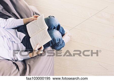 Stock Photography - "Boy reading book, cropped". Fotosearch
