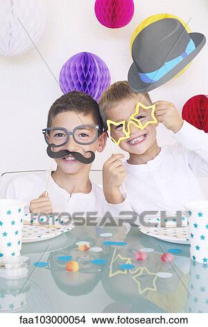 Boys wearing funny disguises at birthday party View Large Photo Image Picture - Boys wearing funny disguises at birthday party. Fotosearch