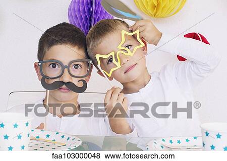 Boys wearing funny disguises at birthday party View Large Photo Image Stock Photo - Boys wearing funny disguises at birthday party. Fotosearch