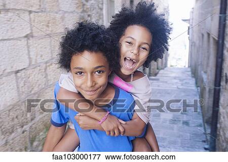 "Brother and sister having fun together outdoors, portrait" View Large Photo Image Stock Photo - "Brother and sister having fun together outdoors, portrait". Fotosearch