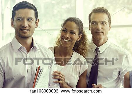 Business associates sharing lighthearted moment together View Large Photo Image Stock Image - Business associates sharing lighthearted moment together. Fotosearch