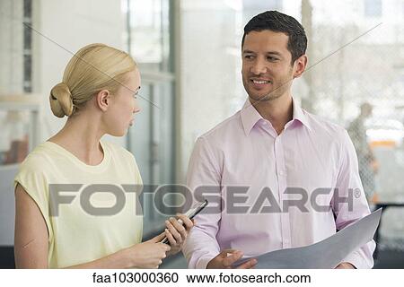 Business colleagues chatting View Large Photo Image Stock Image - Business colleagues chatting. Fotosearch