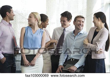 Business team having lighthearted moment together View Large Photo Image Stock Photo - Business team having lighthearted moment together. Fotosearch