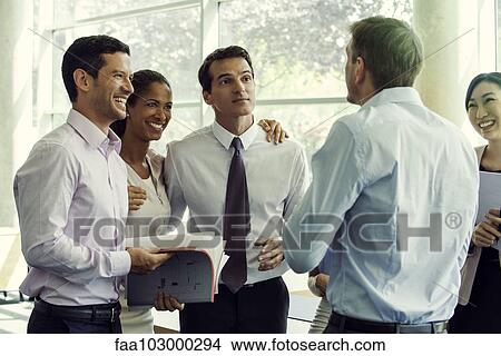 Business team members having lighthearted moment together View Large Photo Image Picture - Business team members having lighthearted moment together. Fotosearch