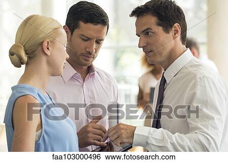 Businessman explaining position to colleagues View Large Photo Image Stock Photograph - Businessman explaining position to colleagues. Fotosearch