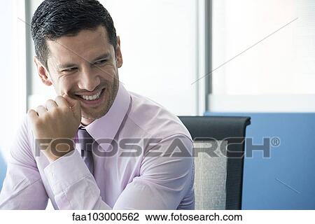 Businessman looking away smiling View Large Photo Image Stock Image - Businessman looking away smiling. Fotosearch
