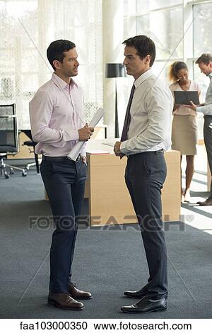 Businessmen chatting View Large Photo Image Stock Image - Businessmen chatting. Fotosearch