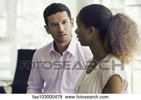 Businesswoman chatting with colleague View Large Photo Image Stock Photo - Businesswoman chatting with colleague. Fotosearch