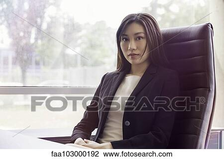 Stock Image - "Businesswoman in office, portrait". Fotosearch