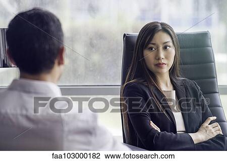 Businesswoman meeting with associate View Large Photo Image Stock Image - Businesswoman meeting with associate. Fotosearch