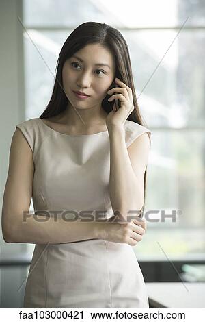 Stock Image - Businesswoman on phone call. Fotosearch