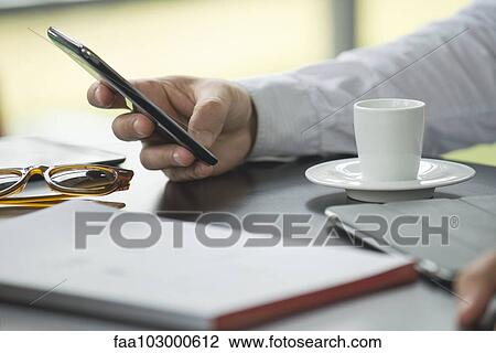 "Coffee break, using smartphone" View Large Photo Image Stock Image - "Coffee break, using smartphone". Fotosearch