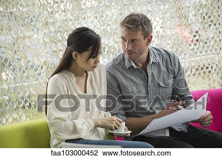 Colleagues working through coffee break View Large Photo Image Stock Image - Colleagues working through coffee break. Fotosearch