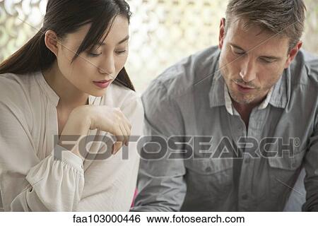 Colleagues working together View Large Photo Image Stock Photograph - Colleagues working together. Fotosearch