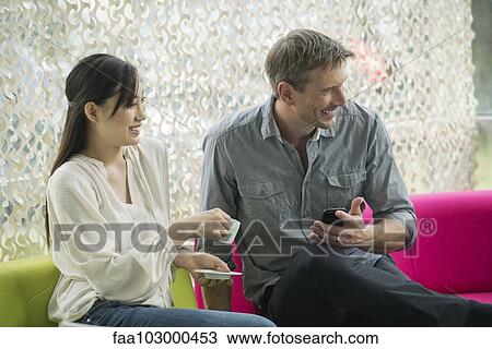 Couple having coffee together View Large Photo Image Stock Image - Couple having coffee together. Fotosearch