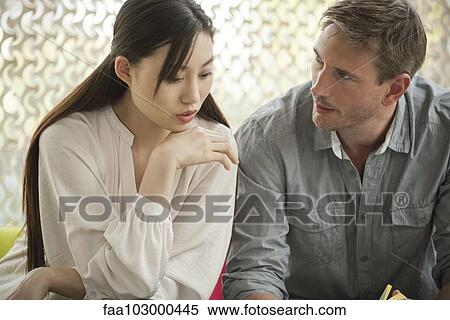Couple having serious conversation View Large Photo Image Stock Photography - Couple having serious conversation. Fotosearch