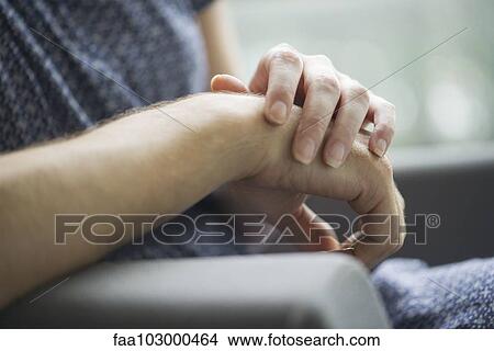 Picture - "Couple holding hands, close-up". Fotosearch