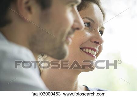 "Couple looking away, smiling" View Large Photo Image Stock Image - "Couple looking away, smiling". Fotosearch