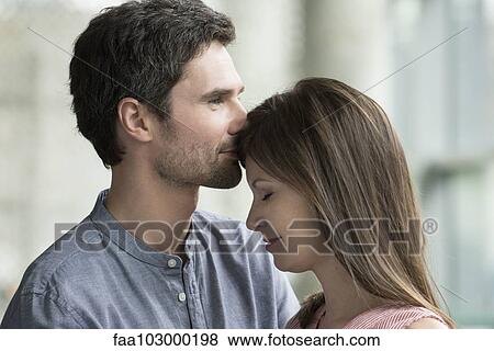 Couple nuzzling View Large Photo Image Stock Photo - Couple nuzzling. Fotosearch