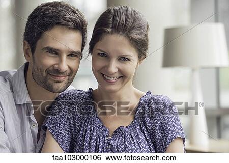 "Couple relaxing together at home, portrait" View Large Photo Image Stock Photograph - "Couple relaxing together at home, portrait". Fotosearch