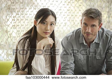 "Couple seated together, portrait" View Large Photo Image Picture - "Couple seated together, portrait". Fotosearch